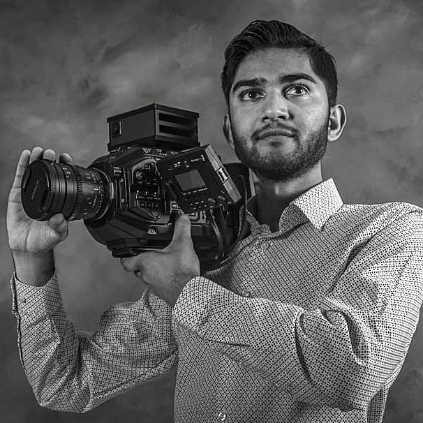Jaymin Kumar, Director of Photography, holding a cinema camera